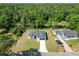 Aerial view displaying the property's layout and proximity to wooded area at 2376 Se 40Th Street Road, Ocala, FL 34480