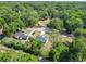 Aerial view of a single Gathering home with large lawn, mature trees, and convenient access to nearby train tracks at 2376 Se 40Th Street Road, Ocala, FL 34480