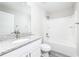 Clean bathroom featuring granite vanity top, new toilet, and shower-tub combination at 2376 Se 40Th Street Road, Ocala, FL 34480