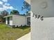 Close-up of the house number '2376' on a modern home with fresh landscaping and a manicured lawn at 2376 Se 40Th Street Road, Ocala, FL 34480