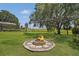 Spacious backyard featuring a custom fire pit perfect for entertaining guests at 26200 Se Highway 42, Umatilla, FL 32784