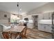 Stylish kitchen with white cabinets, modern appliances, and a cozy dining area for casual meals at 26200 Se Highway 42, Umatilla, FL 32784