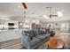 Bright, open-concept area with a modern kitchen, dining space, and a comfortable living room setup at 26200 Se Highway 42, Umatilla, FL 32784
