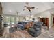 Inviting living room with a cozy seating arrangement and a view of the outdoors through French doors at 26200 Se Highway 42, Umatilla, FL 32784