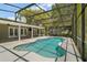 Inviting screened-in pool area is perfect for outdoor relaxation and entertainment at 26200 Se Highway 42, Umatilla, FL 32784