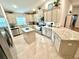Spacious kitchen featuring stainless steel appliances, granite countertops, and a center island at 3107 Ne 46Th Ave, Ocala, FL 34470