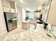 Bright kitchen featuring granite countertops, stainless appliances, and a center island at 3107 Ne 46Th Ave, Ocala, FL 34470