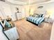 Calming main bedroom with a striped-theme bed and neutral colored walls and decor at 3107 Ne 46Th Ave, Ocala, FL 34470