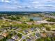 Scenic aerial view featuring a tranquil lake, golf course, and attractive homes in a beautifully planned community at 3587 Nw 55Th Cir, Ocala, FL 34482