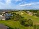 An aerial view featuring a golf course and well-maintained single-Gathering homes in a desirable community at 3587 Nw 55Th Cir, Ocala, FL 34482
