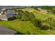 Aerial view of the house with an expansive backyard with views of golf course and surrounding neighborhood at 3587 Nw 55Th Cir, Ocala, FL 34482