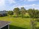 Home boasts a well-maintained backyard with views of the green golf course and tall trees at 3587 Nw 55Th Cir, Ocala, FL 34482