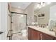 Bathroom featuring a glass door walk-in shower, tile floors and vanity at 3587 Nw 55Th Cir, Ocala, FL 34482