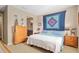 Cozy bedroom with a blue comforter on the bed and warm tones at 3587 Nw 55Th Cir, Ocala, FL 34482