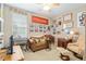 Eclectic bedroom with various furniture, decorations, and artwork at 3587 Nw 55Th Cir, Ocala, FL 34482