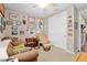 Cozy bedroom featuring carpet floors, ceiling fan, and unique gallery wall with a chair at 3587 Nw 55Th Cir, Ocala, FL 34482