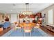 Open-concept dining area leading into a modern kitchen with sleek countertops and stainless steel appliances at 3587 Nw 55Th Cir, Ocala, FL 34482