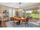 Dining room featuring a stylish light fixture and sliding glass doors leading to the outdoor seating area at 3587 Nw 55Th Cir, Ocala, FL 34482