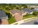 Lovely single-story home with brick driveway, two-car garage, and well-manicured lawn situated near a picturesque lake at 3587 Nw 55Th Cir, Ocala, FL 34482
