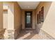 Inviting front entrance features decorative glass door, brick pavers, and stylish wall decor at 3587 Nw 55Th Cir, Ocala, FL 34482