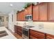 Bright kitchen with stainless steel appliances, spacious countertops, and hardwood flooring at 3587 Nw 55Th Cir, Ocala, FL 34482