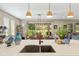 Kitchen island with granite countertops and stainless steel sink boasts backyard views at 3587 Nw 55Th Cir, Ocala, FL 34482