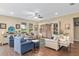 Living room with hardwood floors, built in shelving, and seating area at 3587 Nw 55Th Cir, Ocala, FL 34482