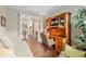 Office space featuring hardwood floors, built in desk, and sitting area at 3587 Nw 55Th Cir, Ocala, FL 34482