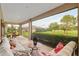 Screened patio offers golf course views and comfortable seating at 3587 Nw 55Th Cir, Ocala, FL 34482