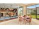 A view from the screened patio into the kitchen and dining area at 3587 Nw 55Th Cir, Ocala, FL 34482
