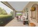 Relaxing screened patio with lounge furniture and golf course views at 3587 Nw 55Th Cir, Ocala, FL 34482