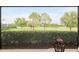 Screened patio offers unobstructed golf course views beyond the hedge at 3587 Nw 55Th Cir, Ocala, FL 34482