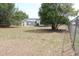A home featuring a very large and well-maintained backyard with a chain link fence at 3807 Sw 143Rd Lane Rd, Ocala, FL 34473