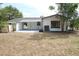 A home featuring a very large and well-maintained backyard with a covered patio at 3807 Sw 143Rd Lane Rd, Ocala, FL 34473