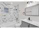 Bathroom featuring marble-tiled shower, a toilet, and a vanity at 3807 Sw 143Rd Lane Rd, Ocala, FL 34473