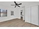 Bedroom with updated floors, closet, and access to kitchen at 3807 Sw 143Rd Lane Rd, Ocala, FL 34473