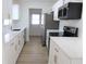 Modern kitchen with quartz countertops, stainless-steel appliances, and ample cabinet space and new lighting at 3807 Sw 143Rd Lane Rd, Ocala, FL 34473
