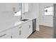 Bright kitchen features white cabinets, quartz countertops, and stainless steel appliances at 3807 Sw 143Rd Lane Rd, Ocala, FL 34473