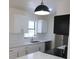 Modern kitchen featuring white cabinets, quartz countertops, and stainless-steel appliances at 3807 Sw 143Rd Lane Rd, Ocala, FL 34473