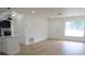 Spacious living room featuring an open floor plan, leading into the kitchen with quartz countertops at 3807 Sw 143Rd Lane Rd, Ocala, FL 34473