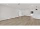 Bright and airy living room with new wood-look floors, fresh paint, and recessed lighting at 3807 Sw 143Rd Lane Rd, Ocala, FL 34473