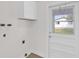 Mud room features storage and an exterior door at 3807 Sw 143Rd Lane Rd, Ocala, FL 34473