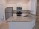 Beautiful kitchen with granite countertops, stainless steel appliances, and white cabinets at 4373 Ne 31St St, Ocala, FL 34470
