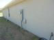 Side view of home with electrical boxes and access at 4373 Ne 31St St, Ocala, FL 34470
