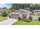 Single car garage and manicured lawn at 4404 Ne 4Th St, Ocala, FL 34470