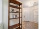 Bright foyer with a decorative chandelier and shelf at 4404 Ne 4Th St, Ocala, FL 34470