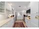 A bright kitchen features shaker cabinets, stainless appliances, and ample counter space at 4404 Ne 4Th St, Ocala, FL 34470