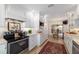 Charming galley kitchen features white cabinets and stainless appliances with an eat-in dining area at 4404 Ne 4Th St, Ocala, FL 34470
