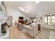 Spacious living room featuring a fireplace, wood floors, and ample seating at 4404 Ne 4Th St, Ocala, FL 34470