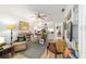 Bright office has built-ins, decor shelving, and a cozy armchair at 4404 Ne 4Th St, Ocala, FL 34470